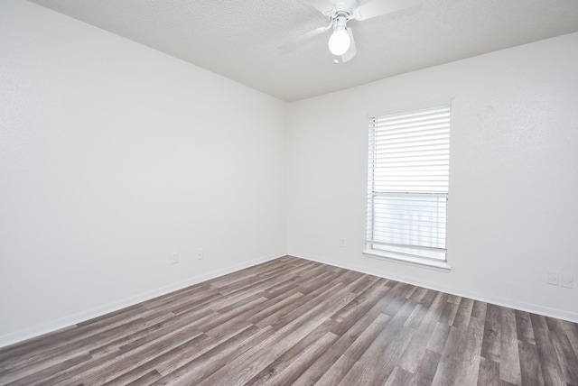 unfurnished room featuring ceiling fan, hardwood / wood-style floors, and a textured ceiling