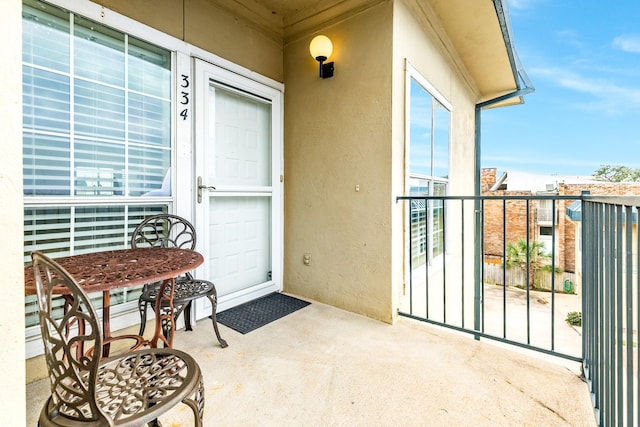 entrance to property featuring a balcony