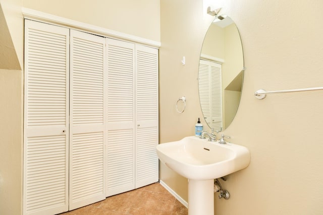 bathroom with tile patterned floors