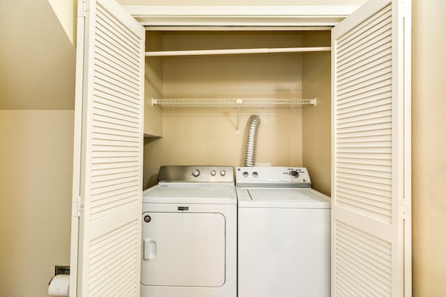 washroom featuring independent washer and dryer