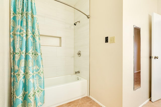 bathroom featuring tile patterned flooring and shower / bath combo