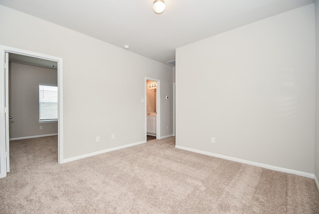 empty room featuring light colored carpet