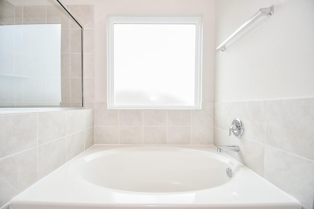 bathroom with a tub