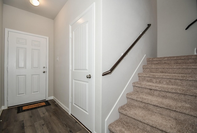 doorway featuring dark wood-type flooring