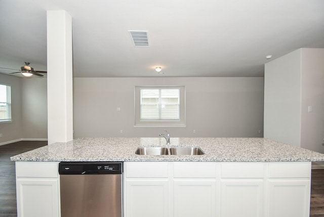 kitchen featuring light stone countertops, white cabinets, sink, ceiling fan, and stainless steel dishwasher