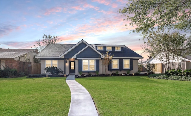 view of front of home with a lawn