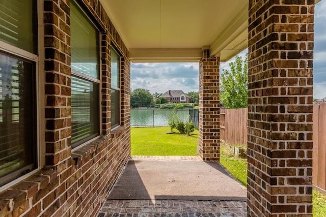 view of patio featuring a water view