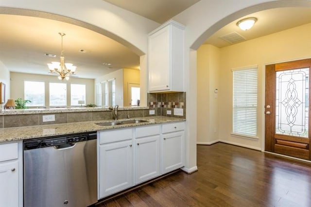 kitchen with dishwasher, sink, an inviting chandelier, white cabinetry, and light stone countertops