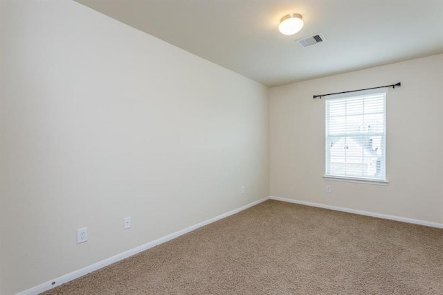 unfurnished room featuring carpet flooring