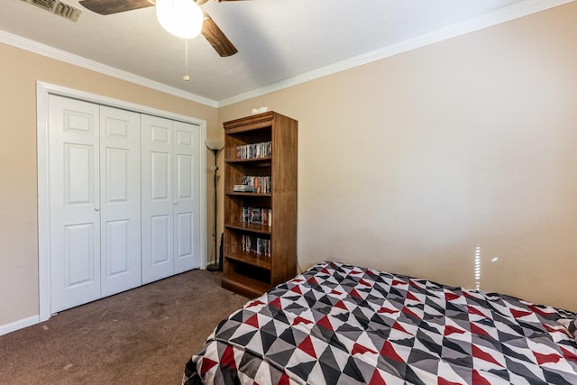 bedroom featuring ceiling fan, a closet, dark carpet, and ornamental molding