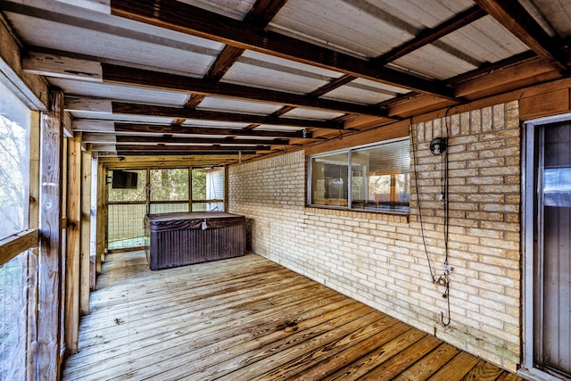 wooden terrace with a hot tub