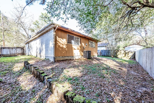 back of property featuring central air condition unit