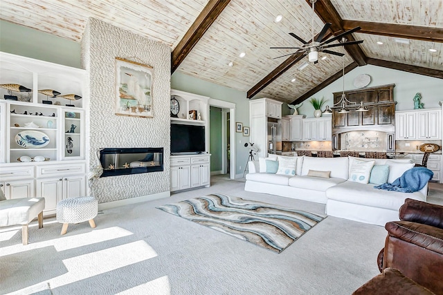 carpeted living room with wooden ceiling, ceiling fan, a fireplace, high vaulted ceiling, and beam ceiling