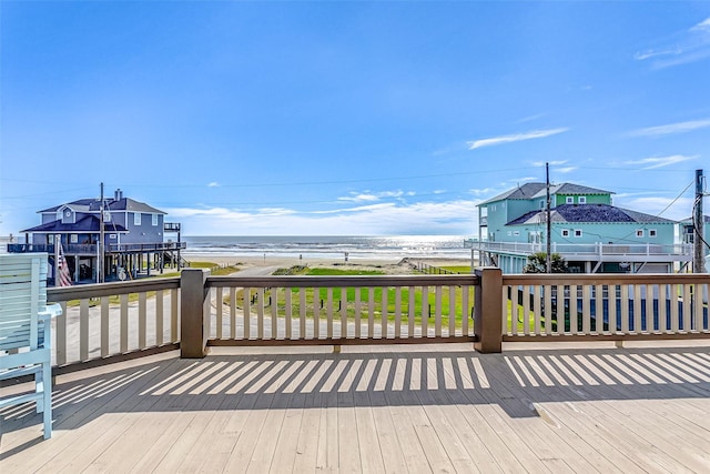 wooden deck with a water view