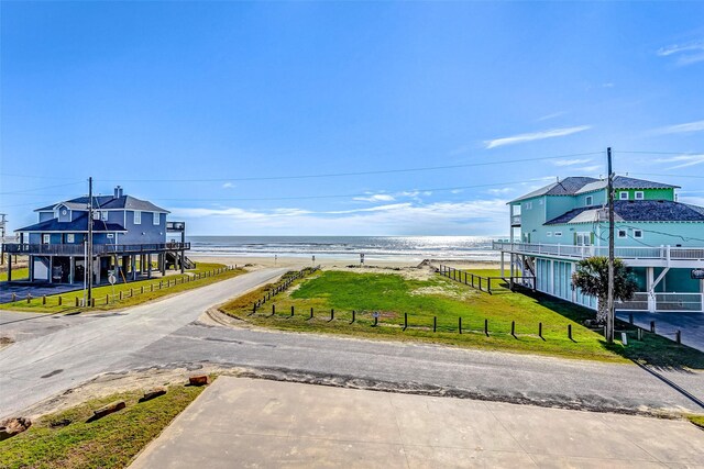 view of street with a water view and a view of the beach