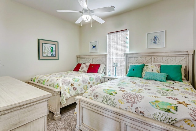 bedroom with ceiling fan and carpet floors