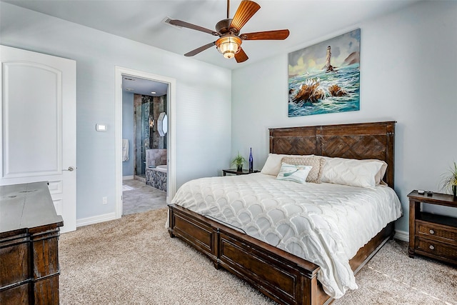 carpeted bedroom featuring ceiling fan and ensuite bathroom