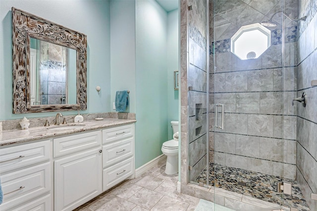 bathroom with walk in shower, vanity, and toilet