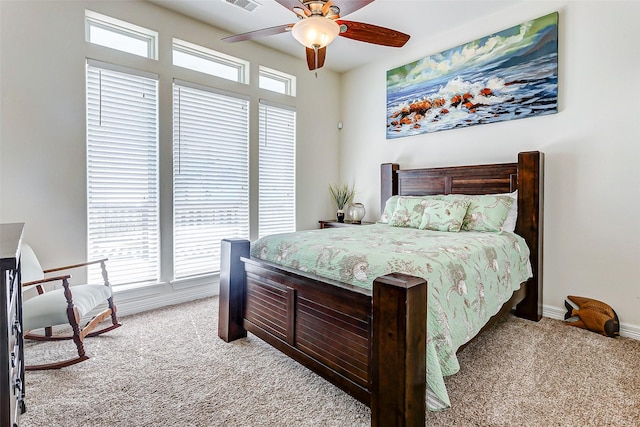 bedroom with ceiling fan and light carpet