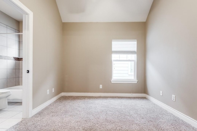 unfurnished room featuring light colored carpet