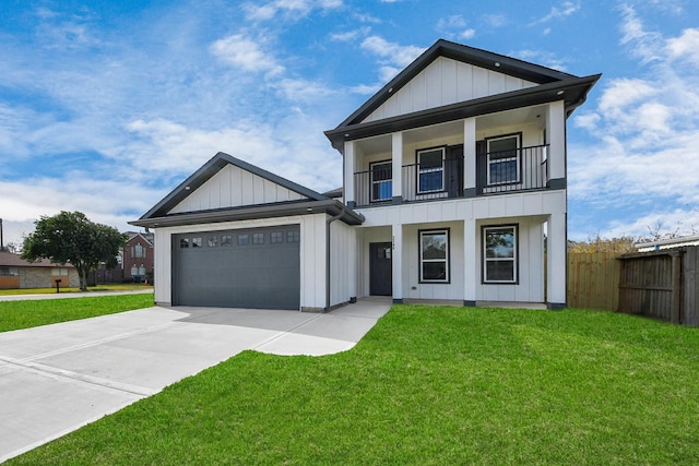 view of front of house with a garage and a front lawn