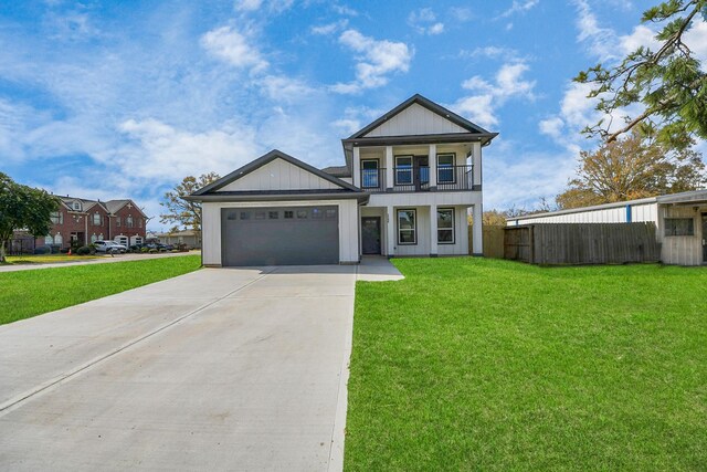 view of front of property featuring a front lawn, a garage, and a balcony