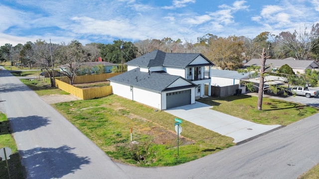 view of front of house featuring a front lawn and a garage