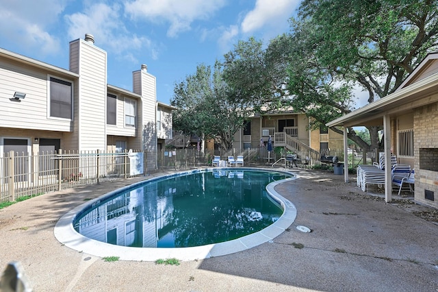 view of swimming pool with a patio area