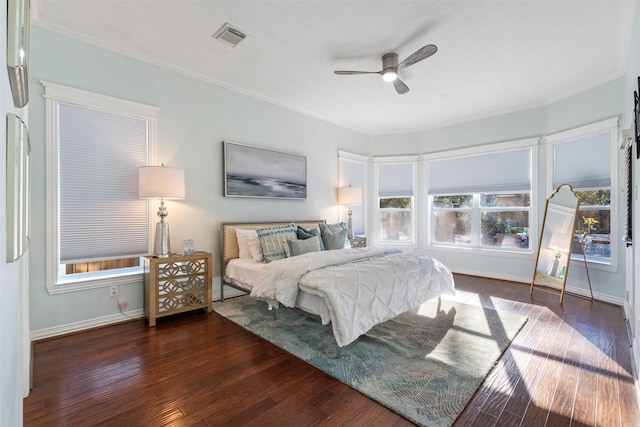 bedroom featuring ceiling fan, dark hardwood / wood-style floors, and ornamental molding