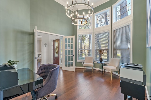 office space with crown molding, a chandelier, a healthy amount of sunlight, and french doors