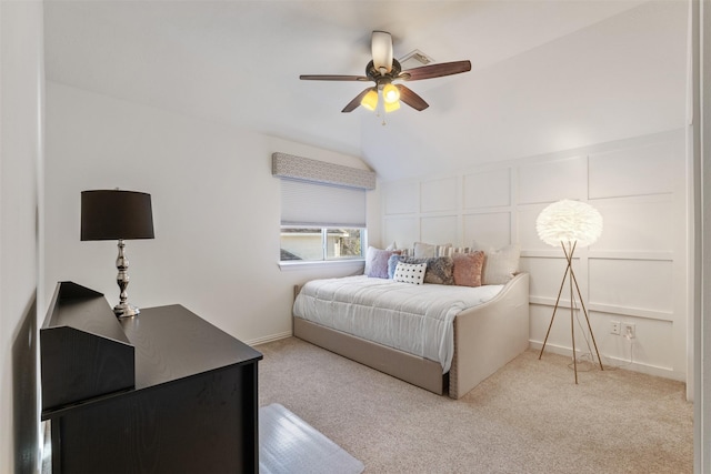 bedroom with ceiling fan, carpet, and lofted ceiling