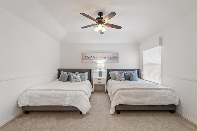 bedroom featuring ceiling fan, carpet flooring, and vaulted ceiling