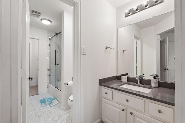 full bathroom with toilet, vanity, shower / bath combination with glass door, and tile patterned flooring