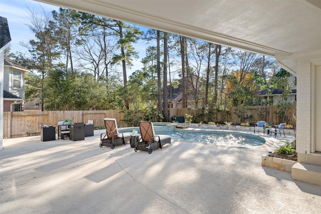 view of pool featuring an in ground hot tub and a patio