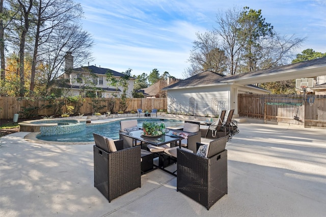 view of swimming pool featuring a patio area and an in ground hot tub