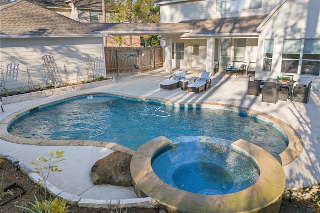 view of swimming pool with an in ground hot tub, a patio area, and an outdoor hangout area