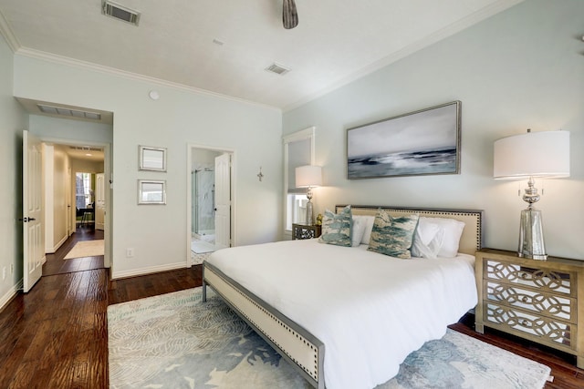 bedroom with ornamental molding, connected bathroom, and dark hardwood / wood-style floors