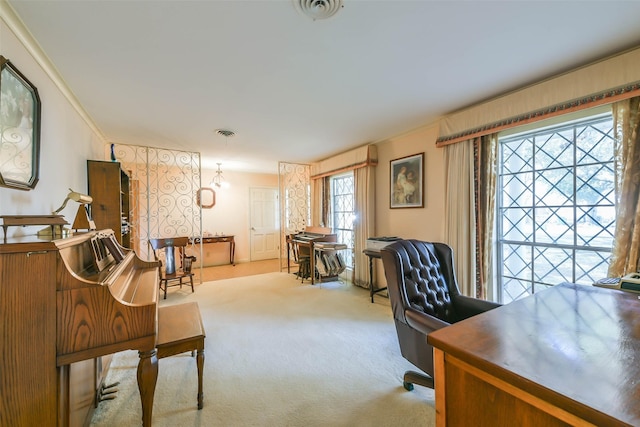 office featuring ornamental molding and light carpet