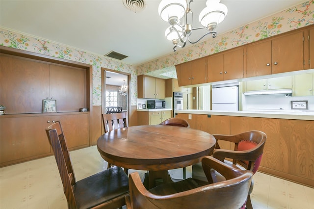 dining space featuring a chandelier