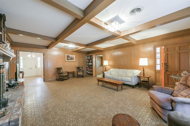 living room featuring wooden walls, beamed ceiling, and coffered ceiling