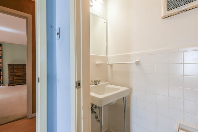 bathroom with tile walls