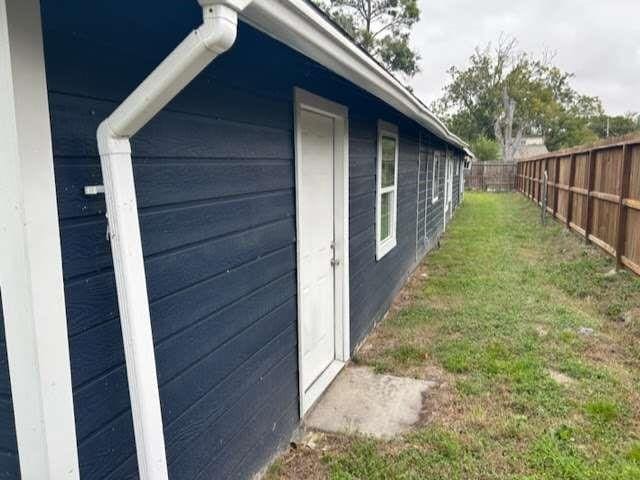 view of home's exterior with a lawn