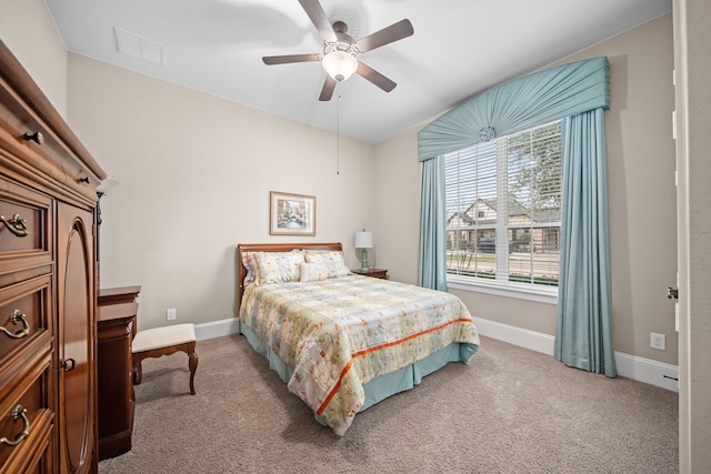 bedroom featuring ceiling fan and light carpet