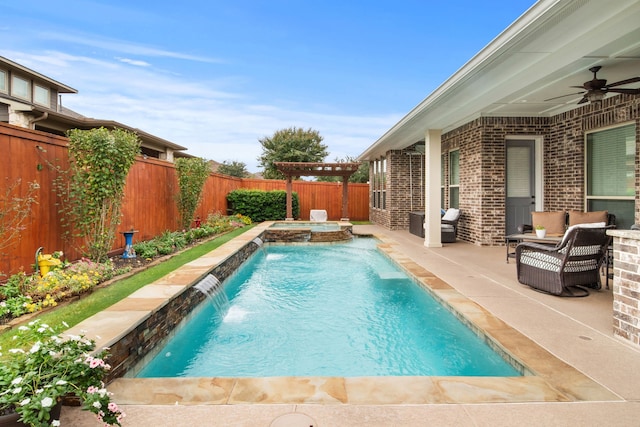 view of swimming pool featuring ceiling fan, a pergola, a patio area, pool water feature, and an in ground hot tub