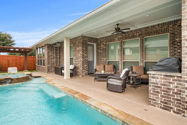 view of swimming pool featuring an outdoor hangout area, a pool with connected hot tub, a ceiling fan, a patio area, and fence