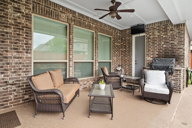 view of patio / terrace featuring ceiling fan and an outdoor living space