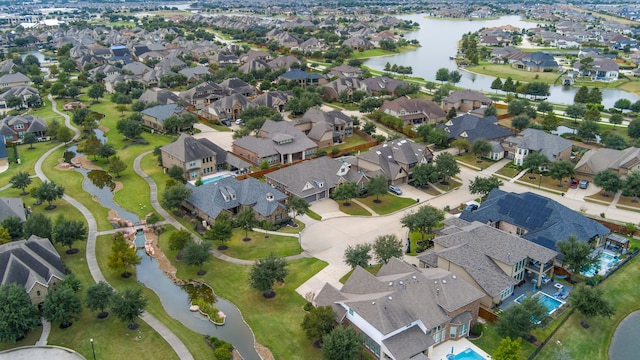 aerial view featuring a residential view and a water view