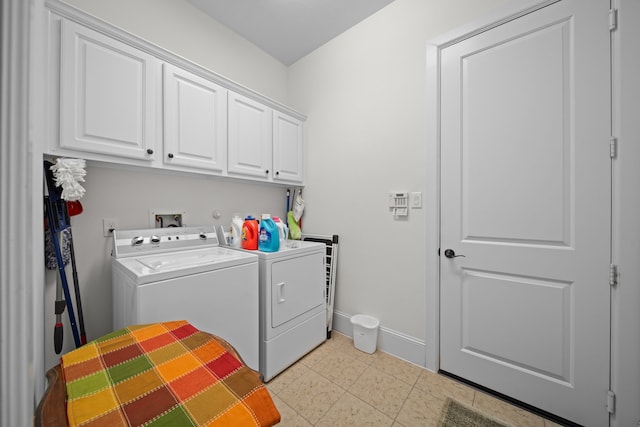 laundry area with cabinets and washer and clothes dryer