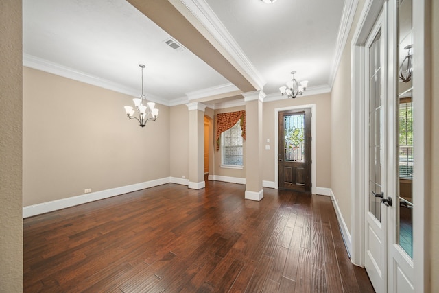 entrance foyer featuring crown molding, baseboards, a notable chandelier, and dark wood-style floors
