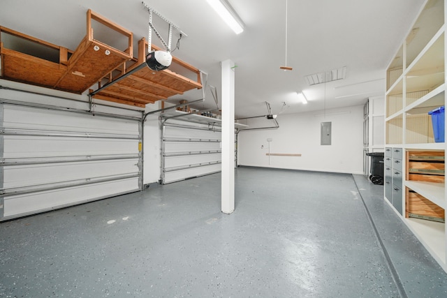 garage featuring electric panel and a garage door opener
